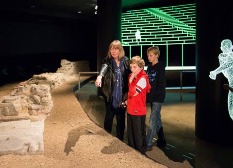 Karen Chester showing children Roman Amphitheatre at Guildhall Art Gallery